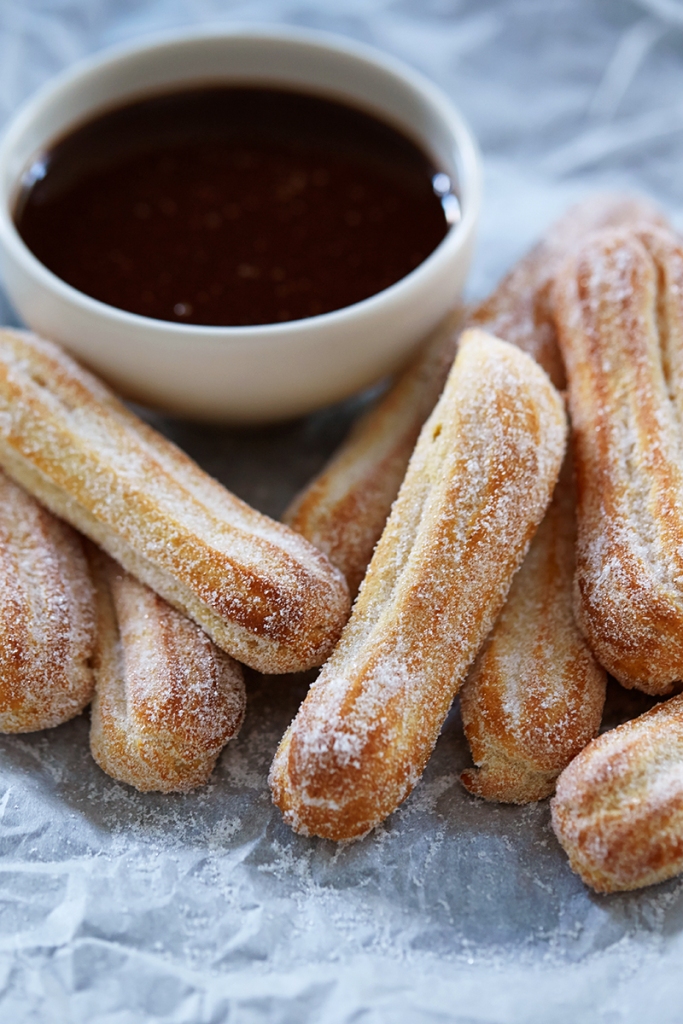 baked churros with chocolate sauce